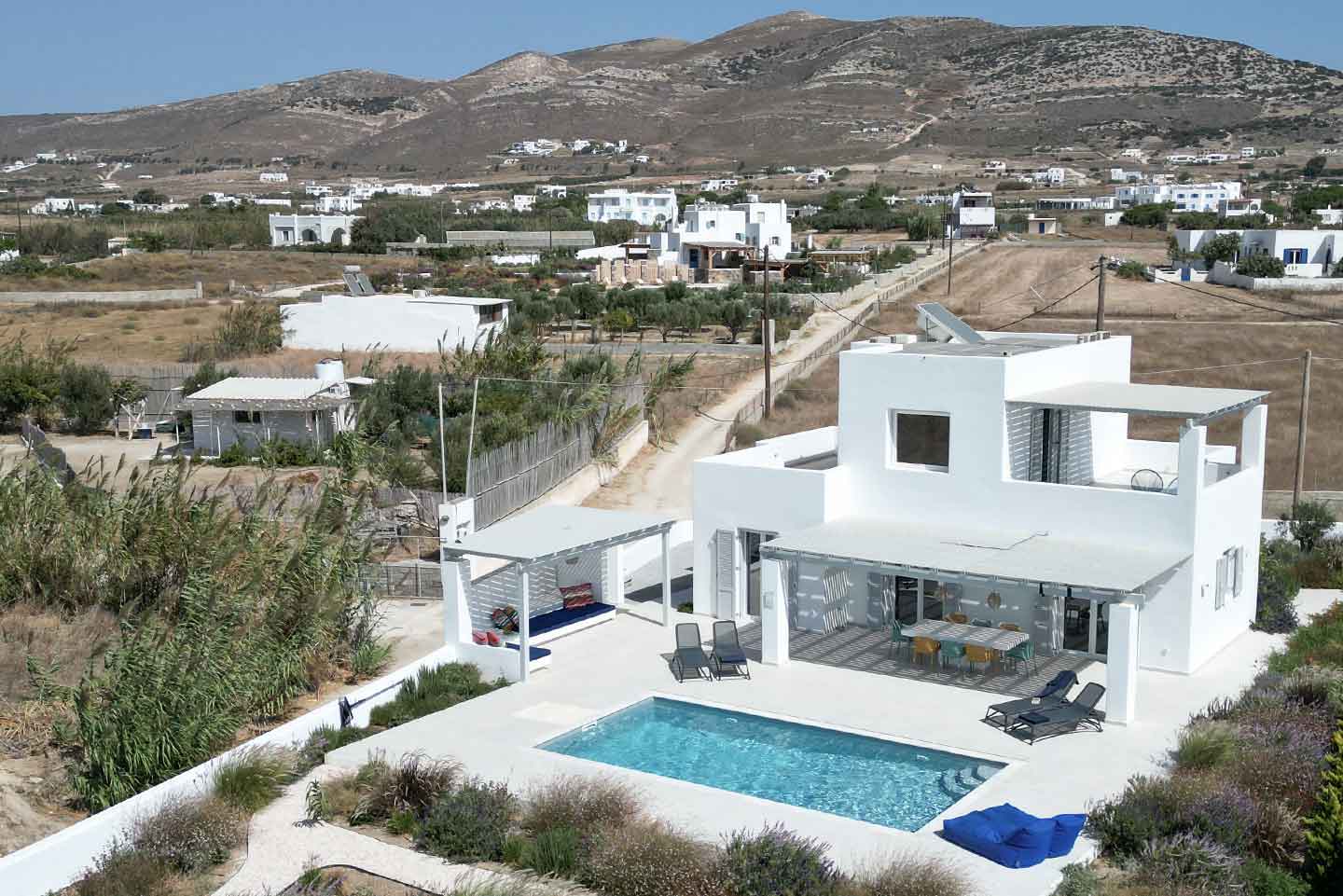 villa aura naxos gems accommodation vacation rentals villas for rent Kastraki Greece terrace lounge pool garden dining sunbeds panorama drone mountain view